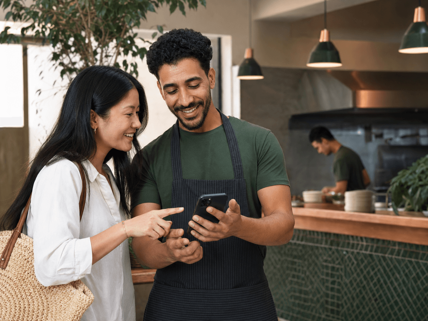 An international customer and a restaurant owner communicating easily across languages
